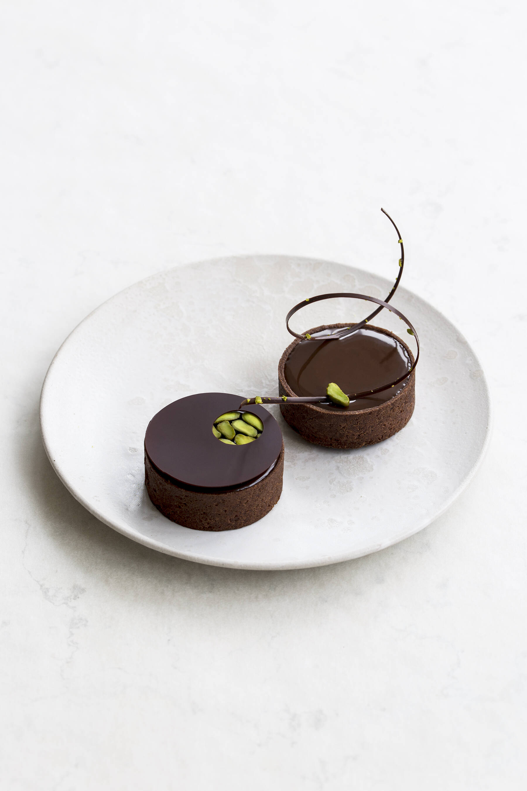 Small pistachio chocolate tarts